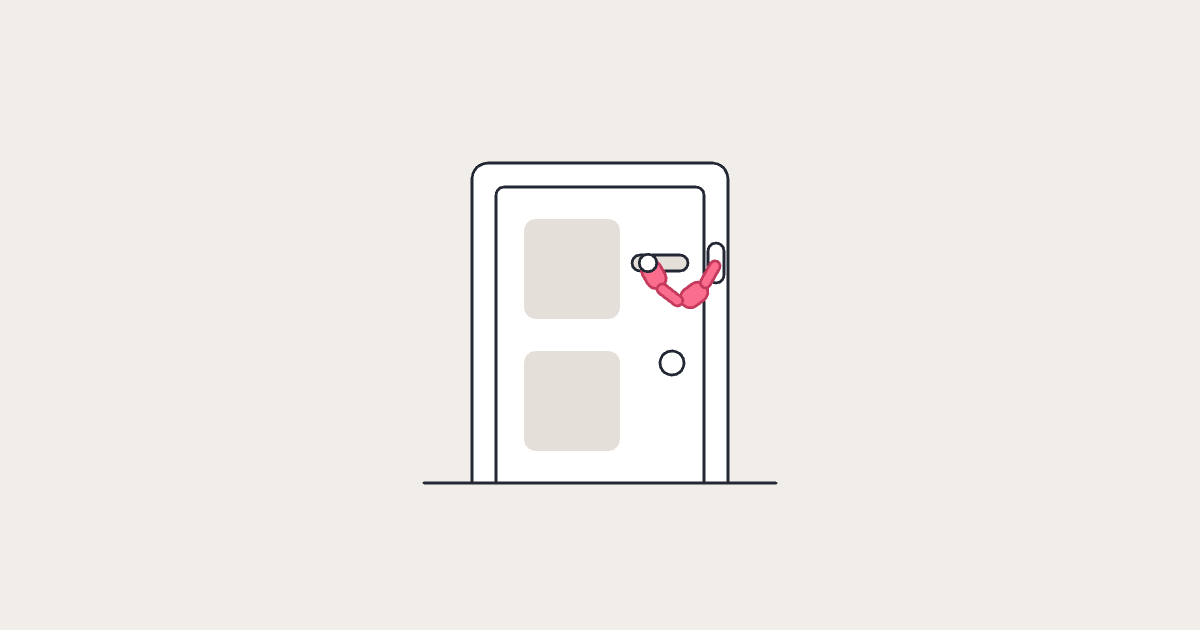 A closed door with its security chain on, hanging slack between the door and the frame